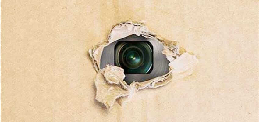 See the hidden camera lens through the hole in the carton